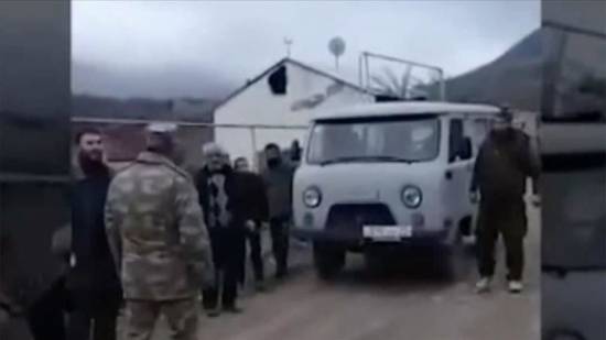 Azerbaijani soldiers help Armenian civilians evacuate