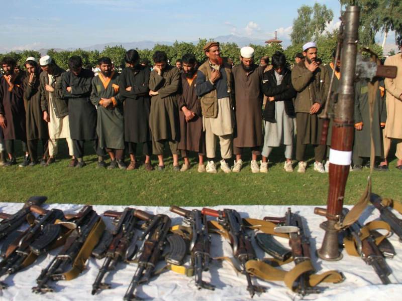 ISIS members and their weapons after their surrender to the Afghanistan government in Jalalabad in November 2019. (Noorullah Shirzada/AFP via Getty Images)